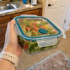Real user holding FreshVault container with fresh salad - authentic photo